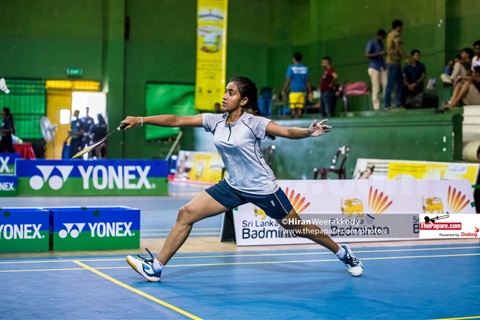women on court playing badminton in a championship