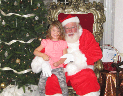 Santa with child at festival