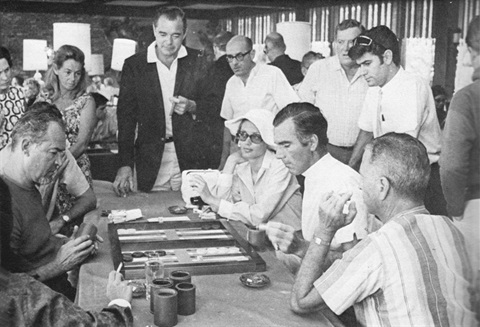 Black and White photo of people playing Backgammon 